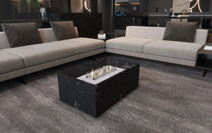 Black marble coffee table with built-in fireplace by MEG Custom Marble (Ziynet A. LLC) in a modern living room with a gray sectional.