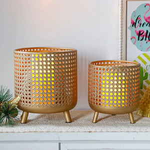 Set of 3 antique gold metal plant pot candle holders with a perforated mesh design and three legs.