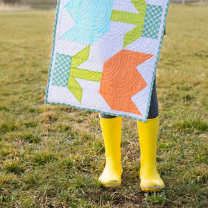 Spring Tulip Table Runner quilt kit by Block Party Quilt Co, Easter tulip design in aqua, lime, and orange blocks.
