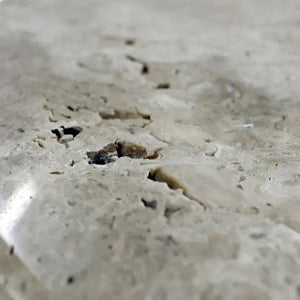 Troia Light Travertine round polished unfilled coffee table surface, light beige with natural pores by Villohome