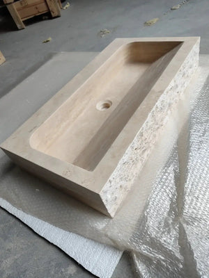 Troia light travertine rectangular wall-mount bathroom sink, beige stone with shallow basin and center drain.