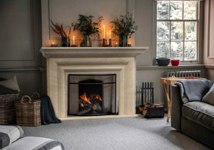 Troia Light Travertine hand-carved fireplace surround by Villohome, light beige stone