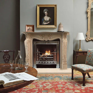 Troia Light Travertine traditional hand-carved fireplace surround in beige travertine with ornate mantel