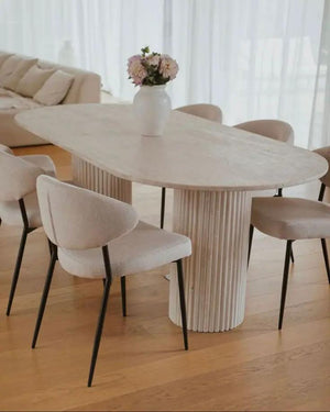 Troia Light Travertine Oval Dining Table by Villohome in beige with fluted round legs