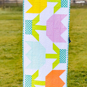Spring Tulip Table Runner Pre-Cut Quilt Kit by Block Party Quilt Co; lime, yellow, pink tulip blocks with turquoise border