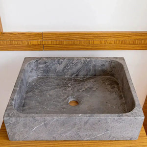 Tundra Gray Marble rectangular above-counter bathroom sink; gray stone with white veining.