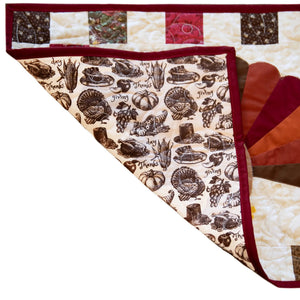 Quilt kit for Turkey Thanksgiving table runner; burgundy binding and turkey-print backing.