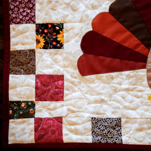 Block Party Quilt Co Holiday quilted table runner kit bundle; patchwork in cream, red, and floral accent blocks.