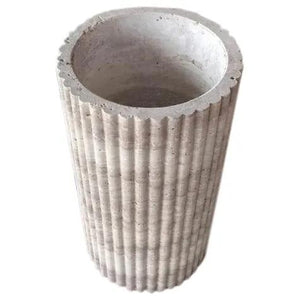 Planter beige ribbed concrete, fluted cylindrical design with open top.