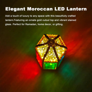 12-inch gold hexagonal Moroccan candle lantern with ornate metal cutouts and stained glass panels.