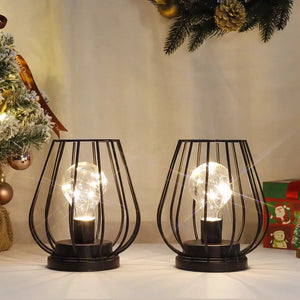 7'' tall set of 2 black metal battery-operated lamps with cage-frame designs and clear bulbs