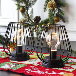 7-inch tall set of 2 black metal battery-operated lamps with open cage frames and warm bulbs