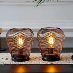 Battery-powered outdoor table lamps set of 2 by JHY DESIGN, 6.7-inch tall, with bronze wire-mesh cages and warm bulbs.