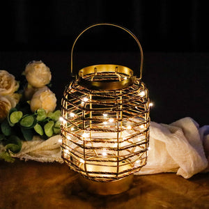 7.7-inch metal cage LED cordless table lamp, battery-operated, gold with warm string lights.