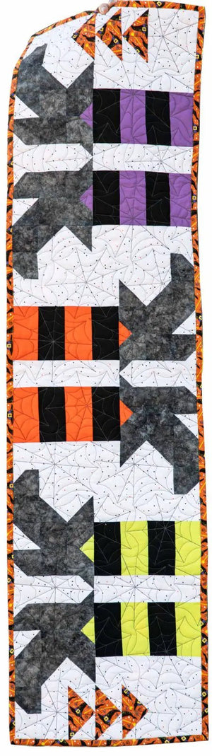 Witches Feet Table Runner Quilt Kit by Block Party Quilt Co; Halloween quilt with orange, black and purple blocks.