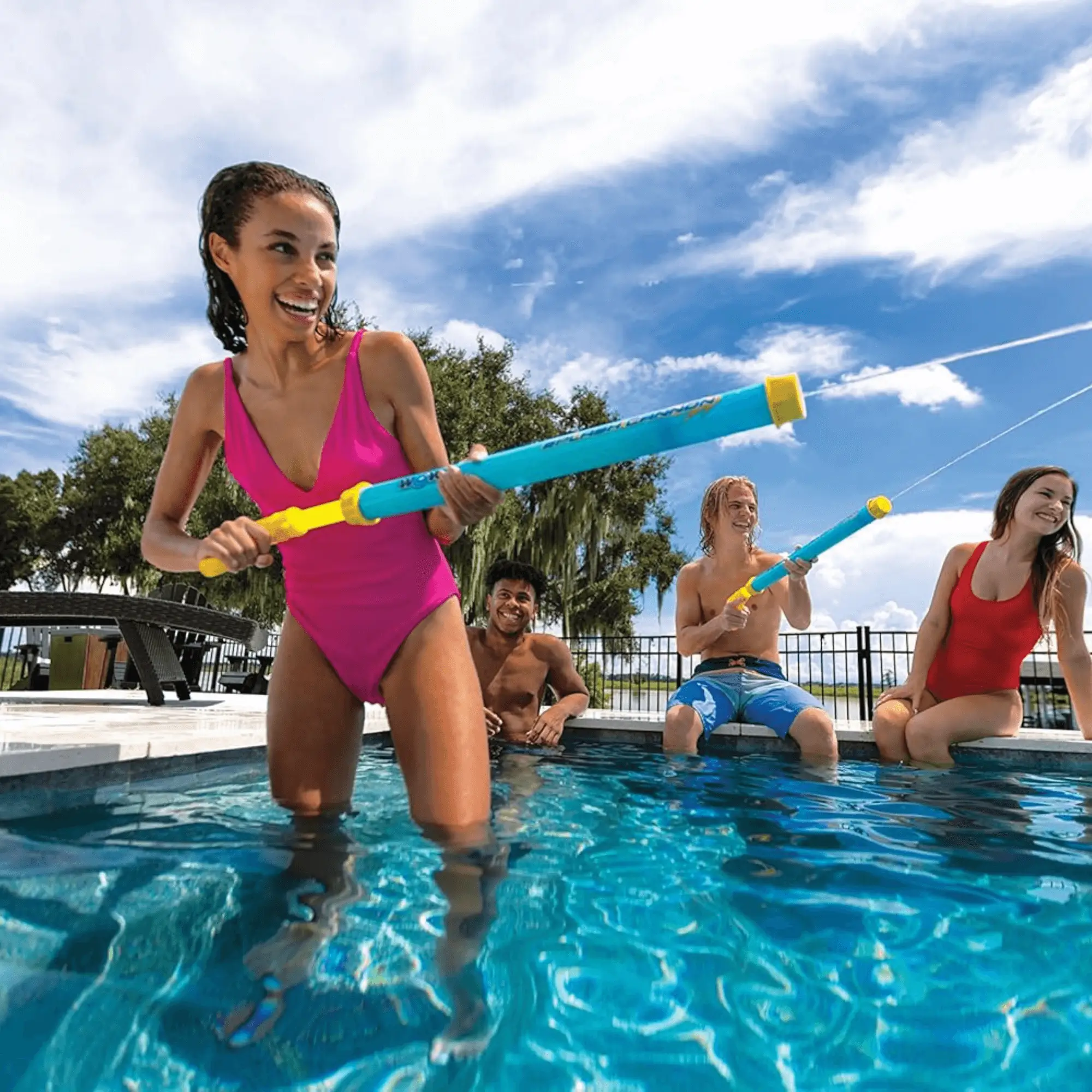 WOW Watersports Splash Cannon water toy 12-pack; people in an outdoor pool play with blue and yellow cannons.