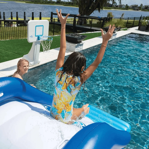 WOW Watersports Cascade Pool Slide by Jupiter Gear; white and blue inflatable pool slide with kids playing in the pool.