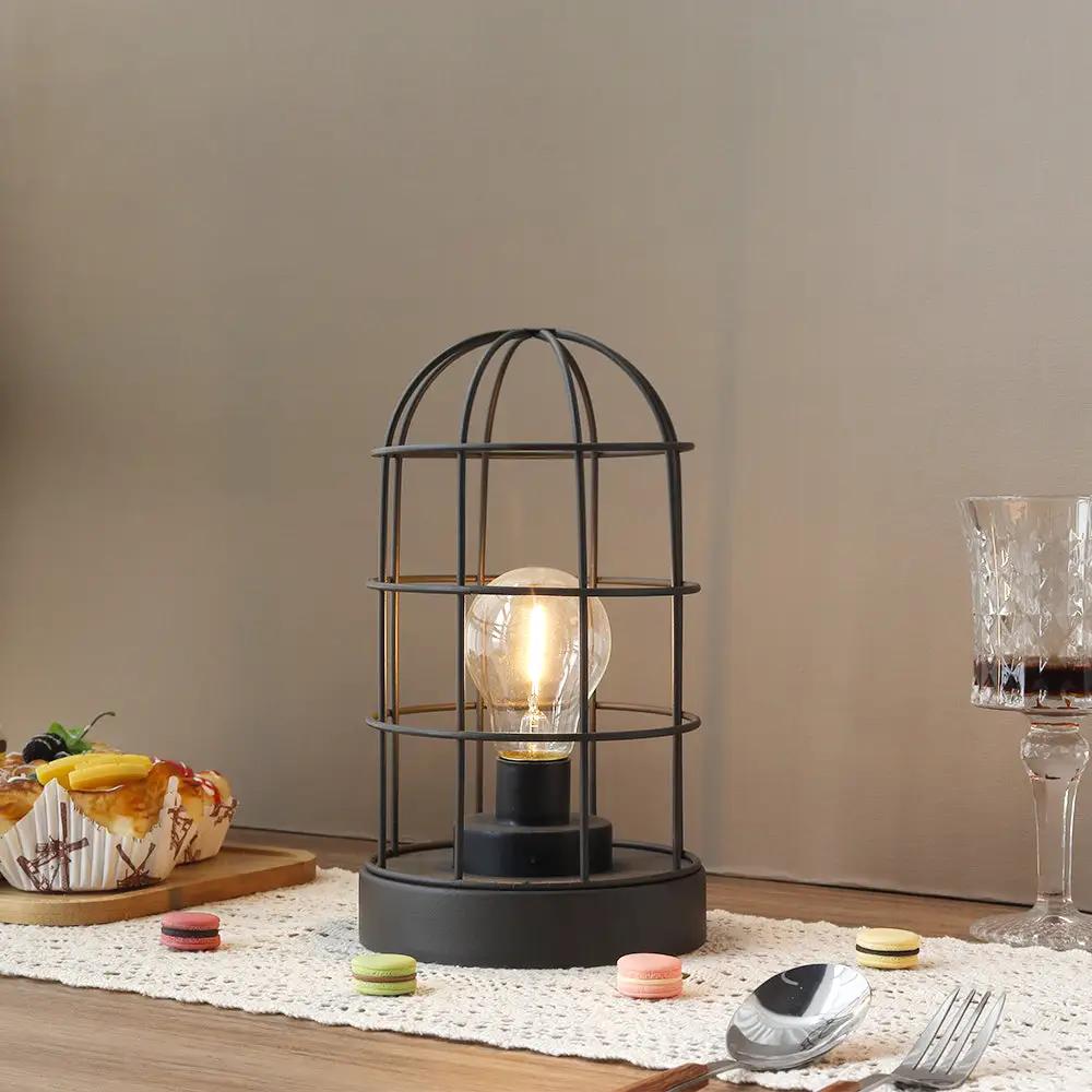 Decorative table lamp, black metal cage, cordless with LED bulb, 9.5-inch tall
