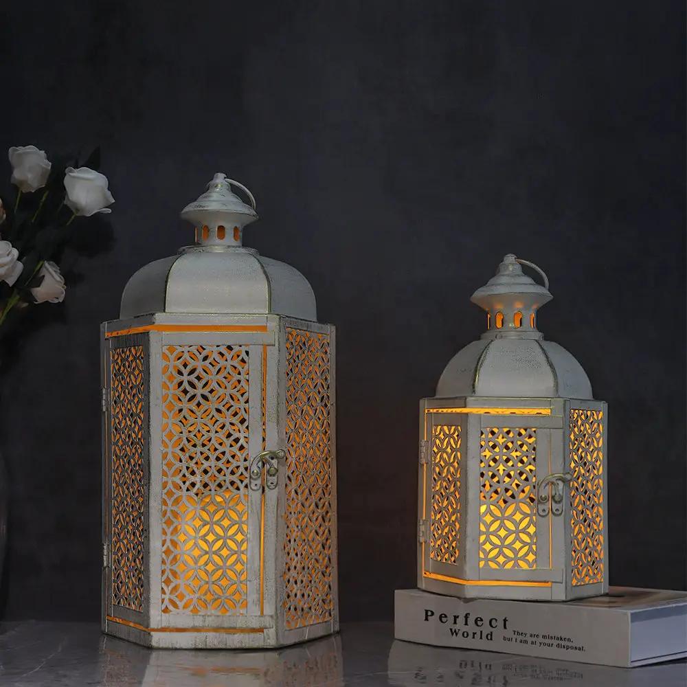 Decorative candle lanterns by JHY DESIGN, 15 and 11 inches, white distressed metal with lattice panels and warm glow.