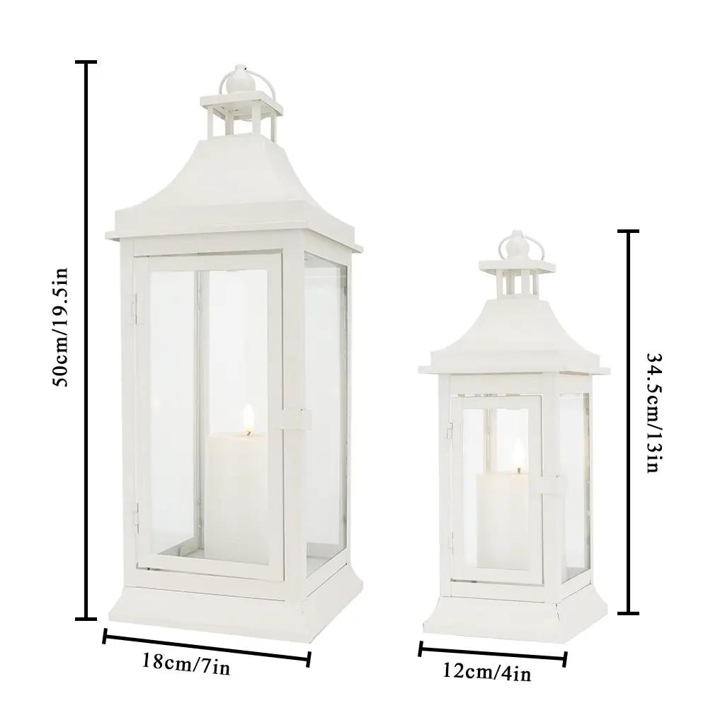 Set of 2 white outdoor candle lanterns with glass panes, 19.5in and 13in tall, decorative garden lanterns