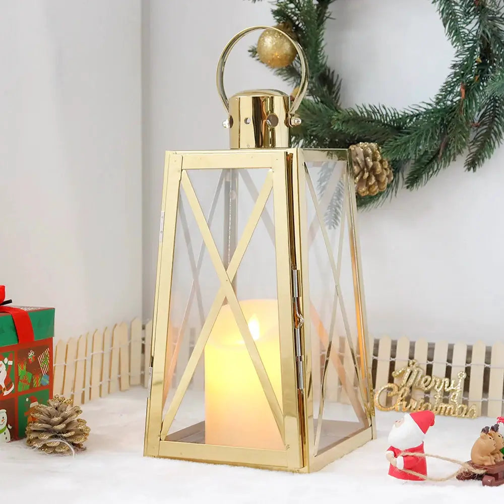12-inch stainless steel decorative lantern (trapezoid) with glass panels and lit candle inside