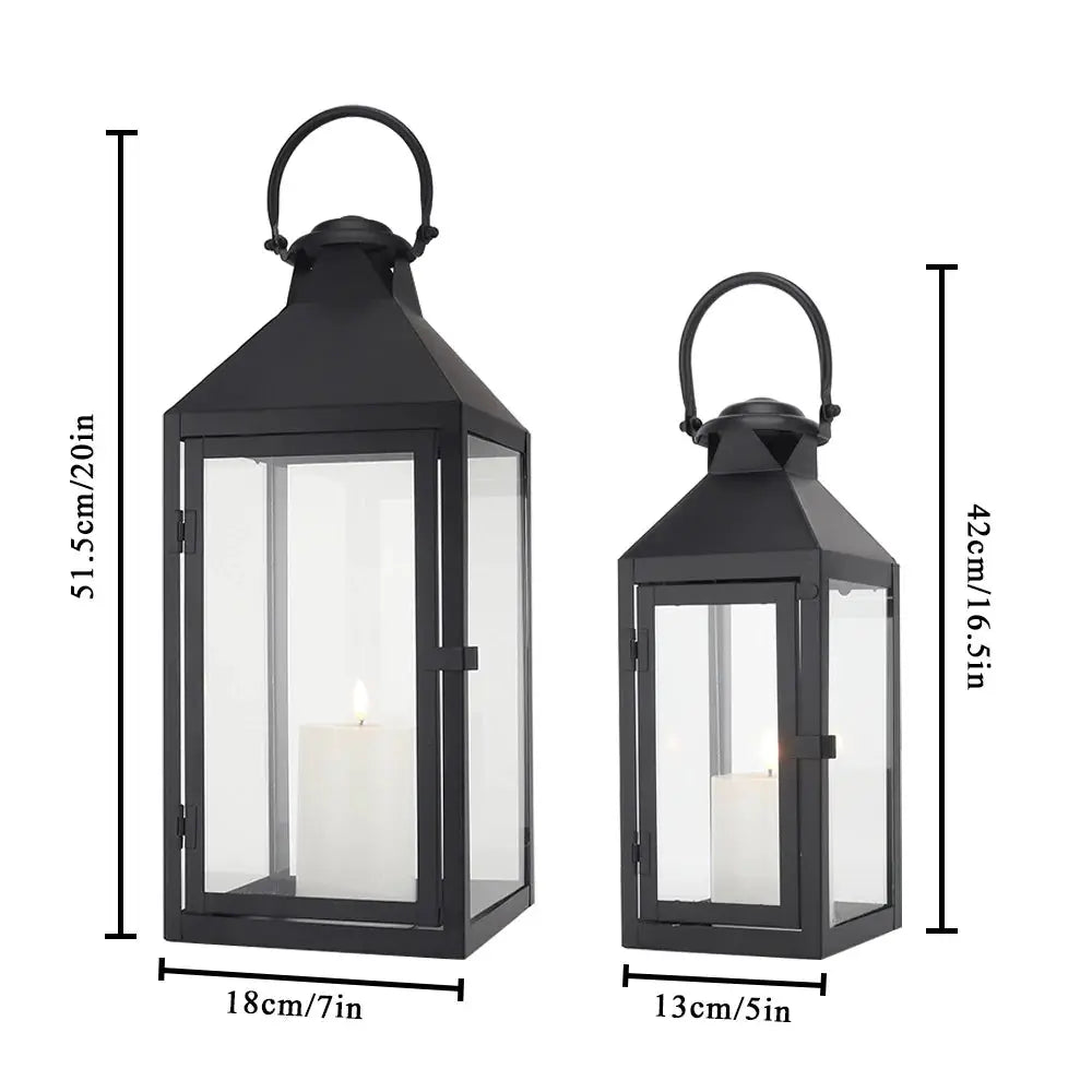 Set of 2 JHY DESIGN black metal candle lanterns with glass panels; vintage style, 20in and 16.5in tall.