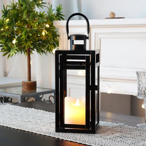 12'' High Metal Decorative Candle Lantern (Black) by JHY DESIGN with a lit candle inside.