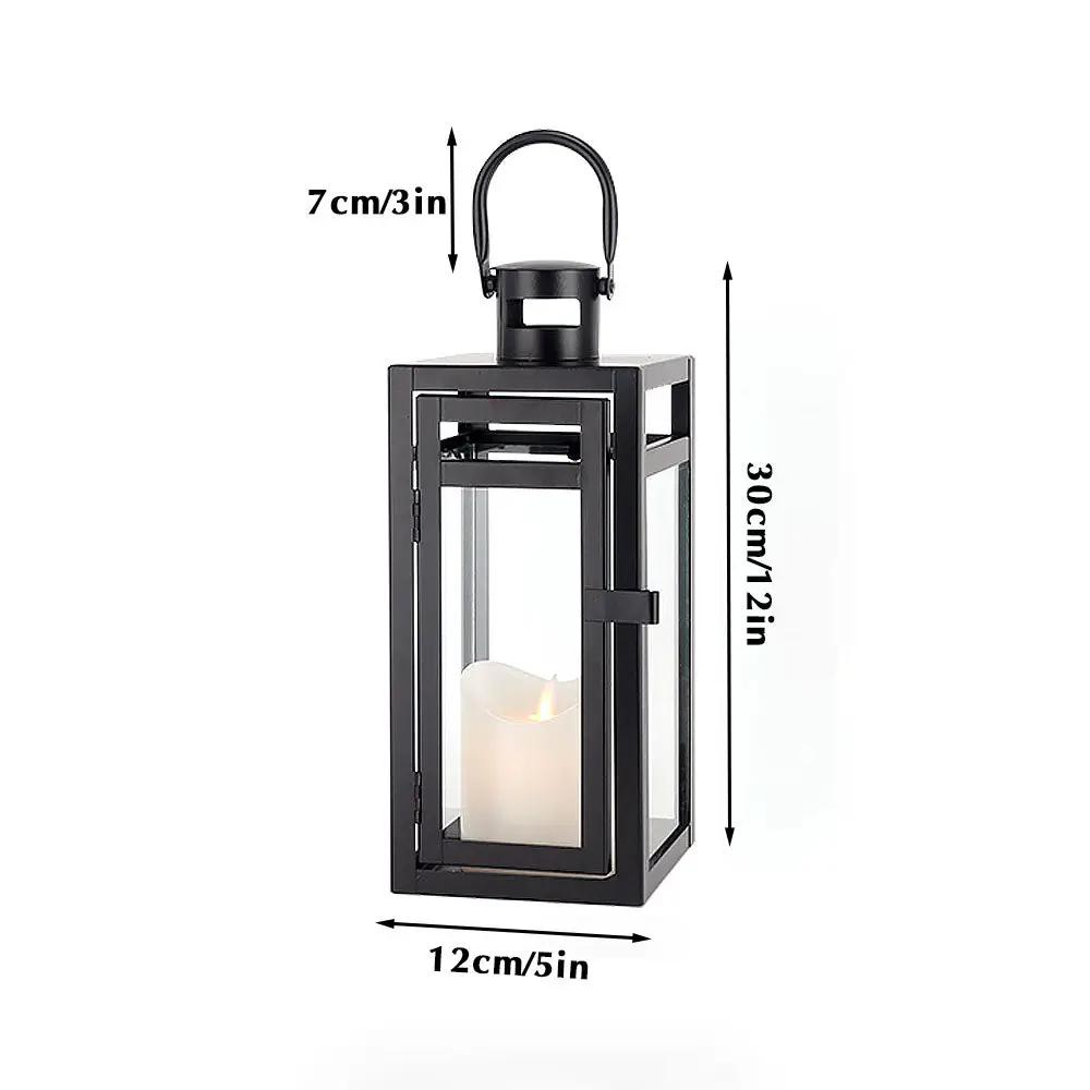 12'' High black metal decorative candle lantern by JHY DESIGN with glass panels and candle inside