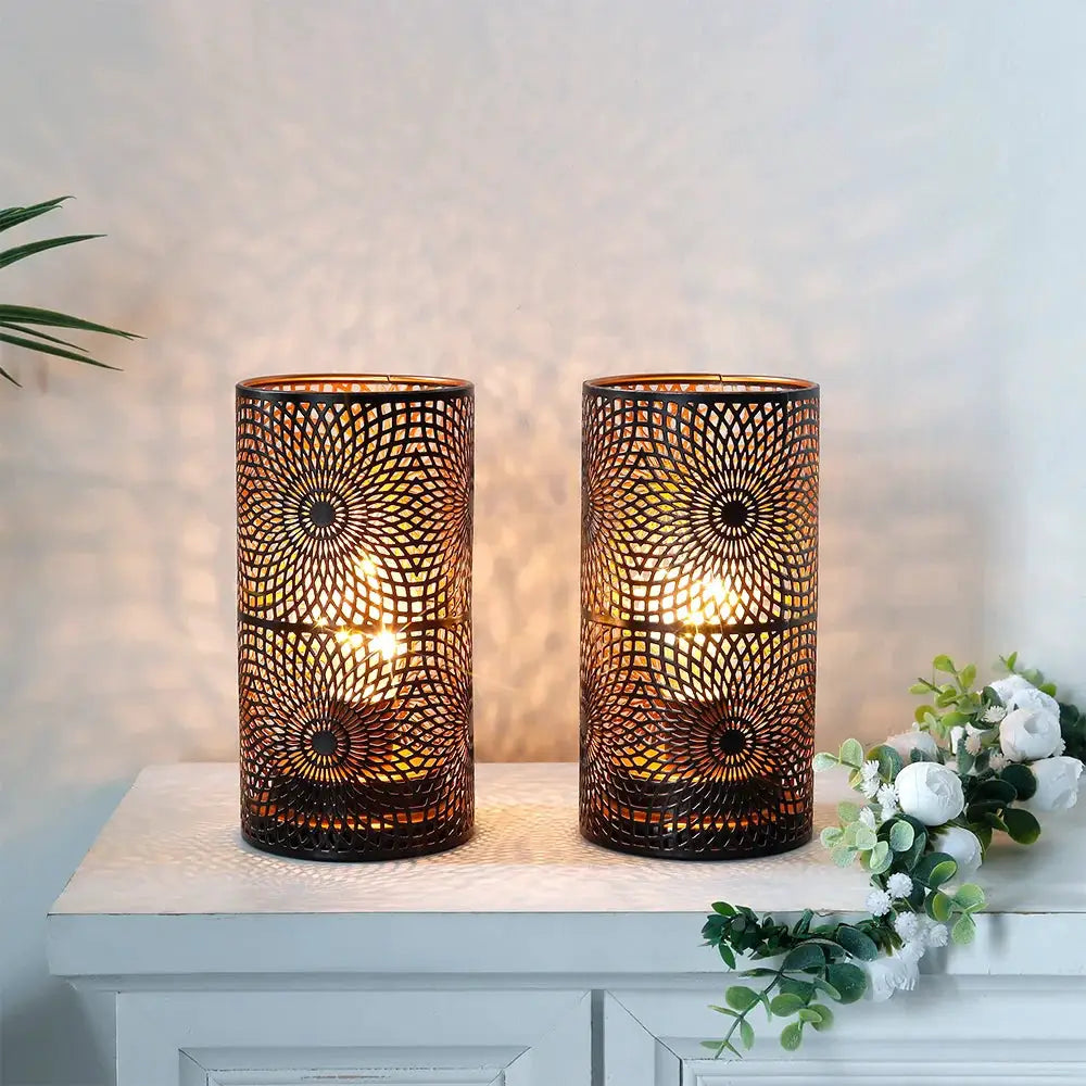 Set of 2 black metal patterned lantern-style table lamps, battery-operated by JHY DESIGN, 7.5 inches tall, warm glow.