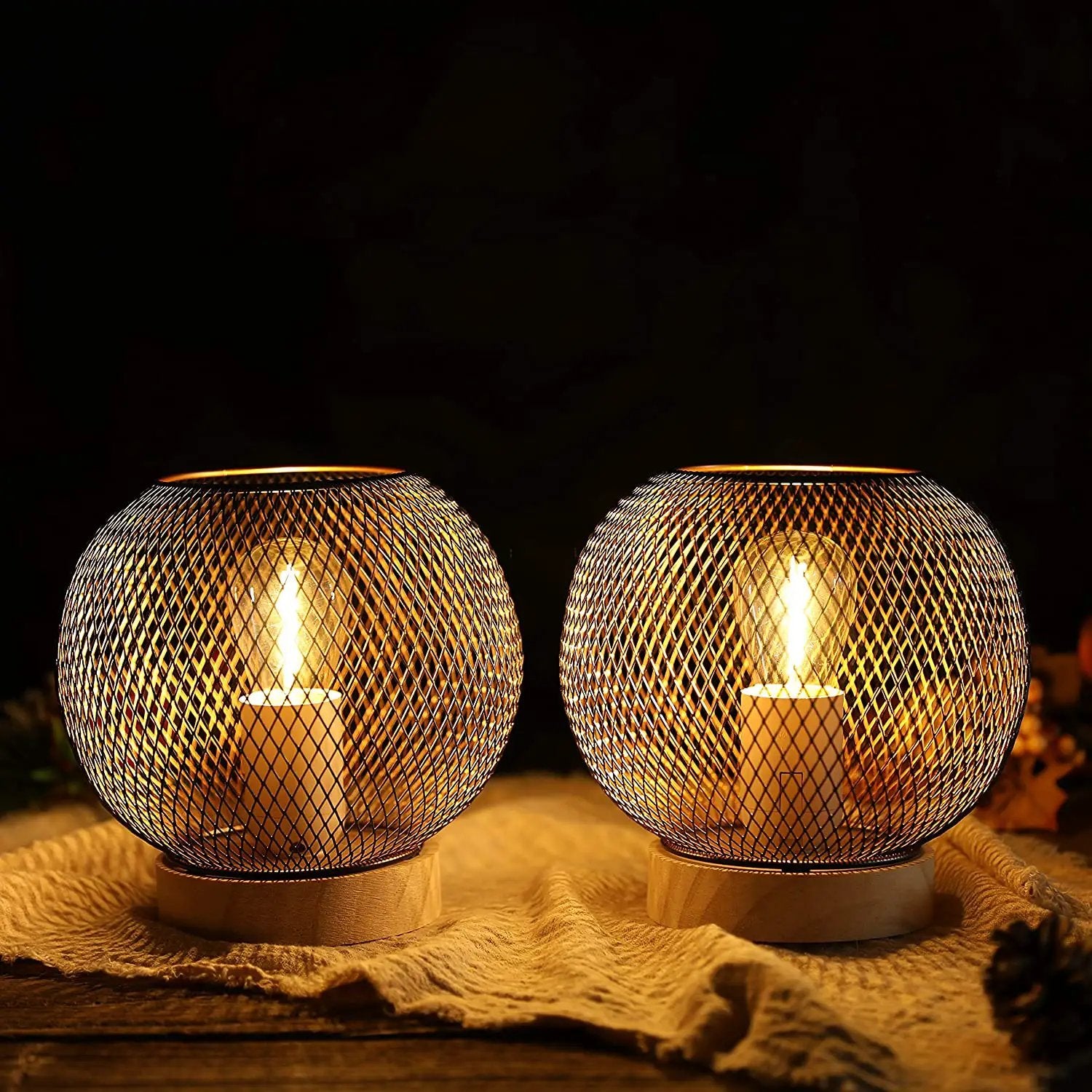 Battery-powered table lamps, 7.5'' high, set of 2, with metal mesh globe and warm ambient glow on wooden bases.