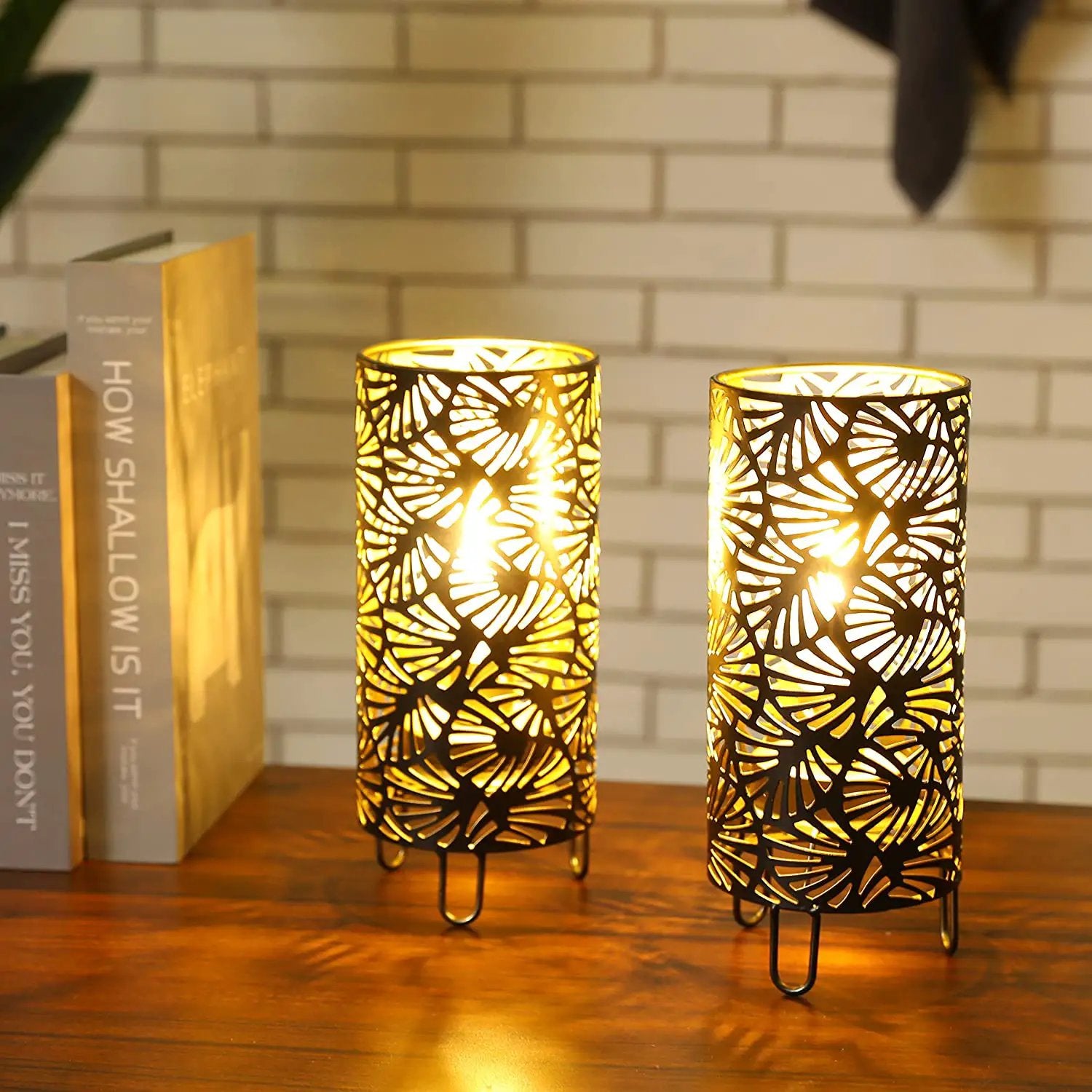 9-inch high black metal lamps set of 2 with leaf-pattern cages, battery-powered, warm light.