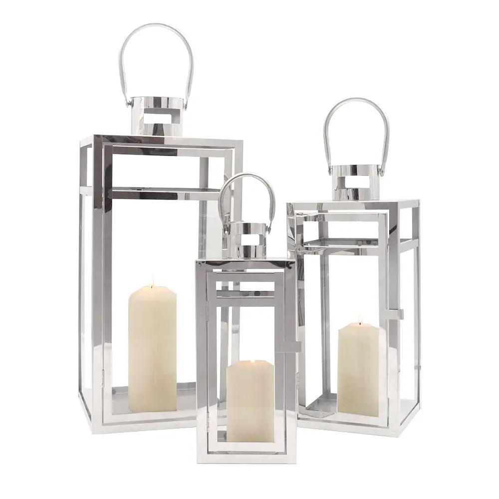Set of 3 stainless steel candle lanterns with clear glass panels in 19in, 15in and 12in heights by JHY DESIGN