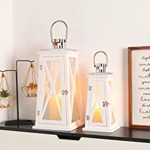 Decorative candle lanterns by JHY DESIGN, white metal rustic set of 2 with glass panels and hanging handles.