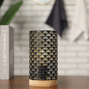 7.5-inch cordless metal lamp with a black perforated lattice shade on a wood base, warm glow.