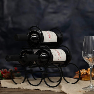 Iron table-top wine rack in black metal holding two wine bottles