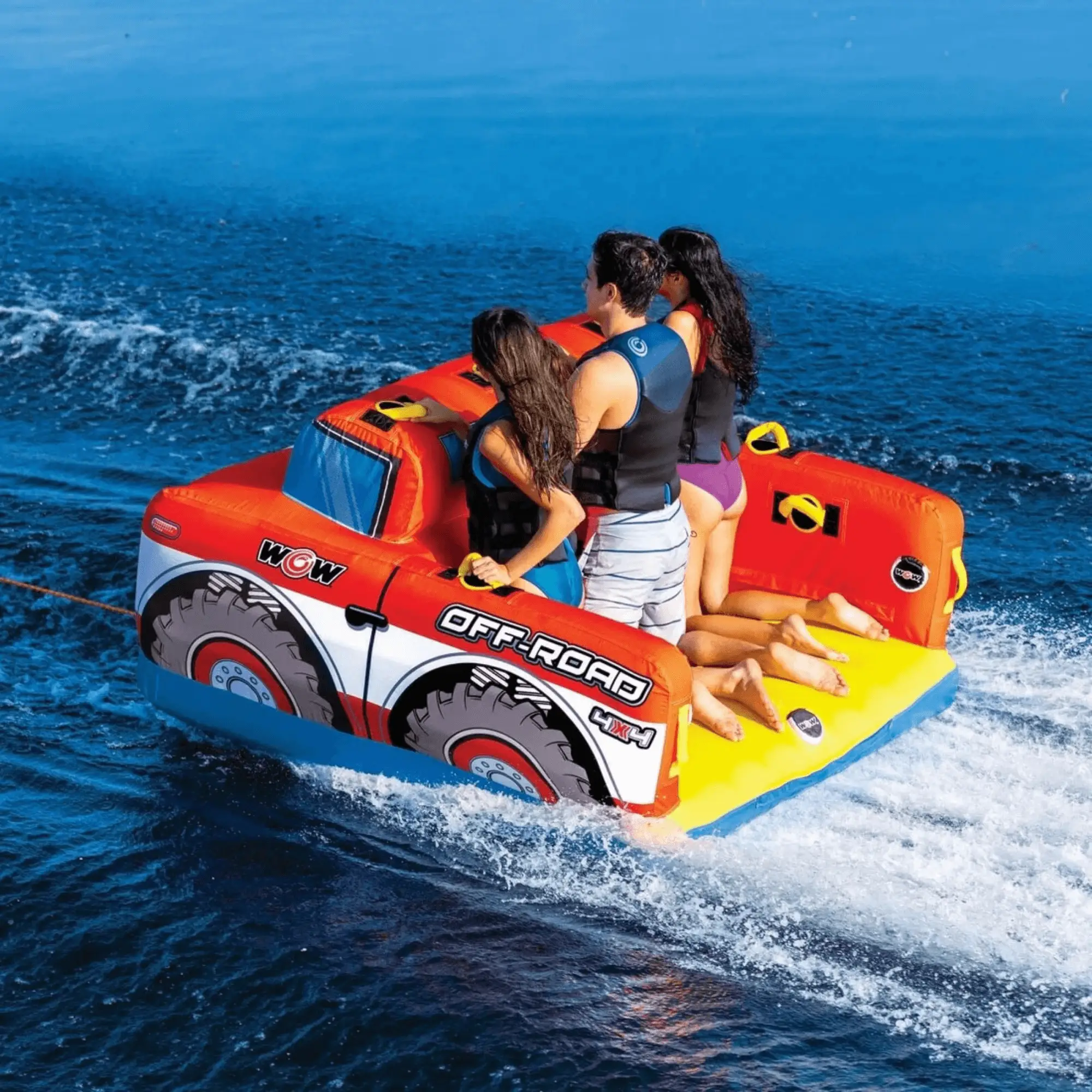 WOW Watersports Off-Road Truck 3-Person Towable, orange inflatable with tire graphics and WOW logo