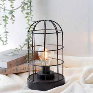 Decorative table lamp, 9.5in H, cordless black metal cage with LED bulb.