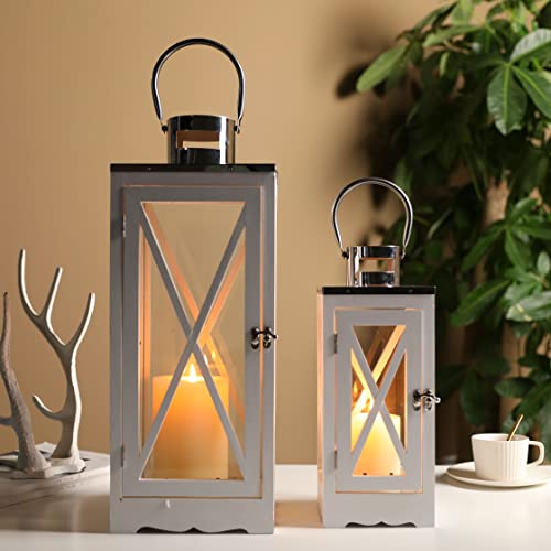 Metal decorative candle lanterns set of 2, silver-gray finish with glass panels and X-cross bars, 17.5 and 24.5 in tall.