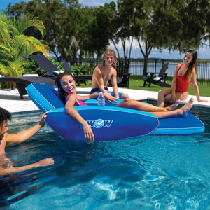 Two blue WOW Watersports Modern Lounger pool floats in a sunny backyard pool.
