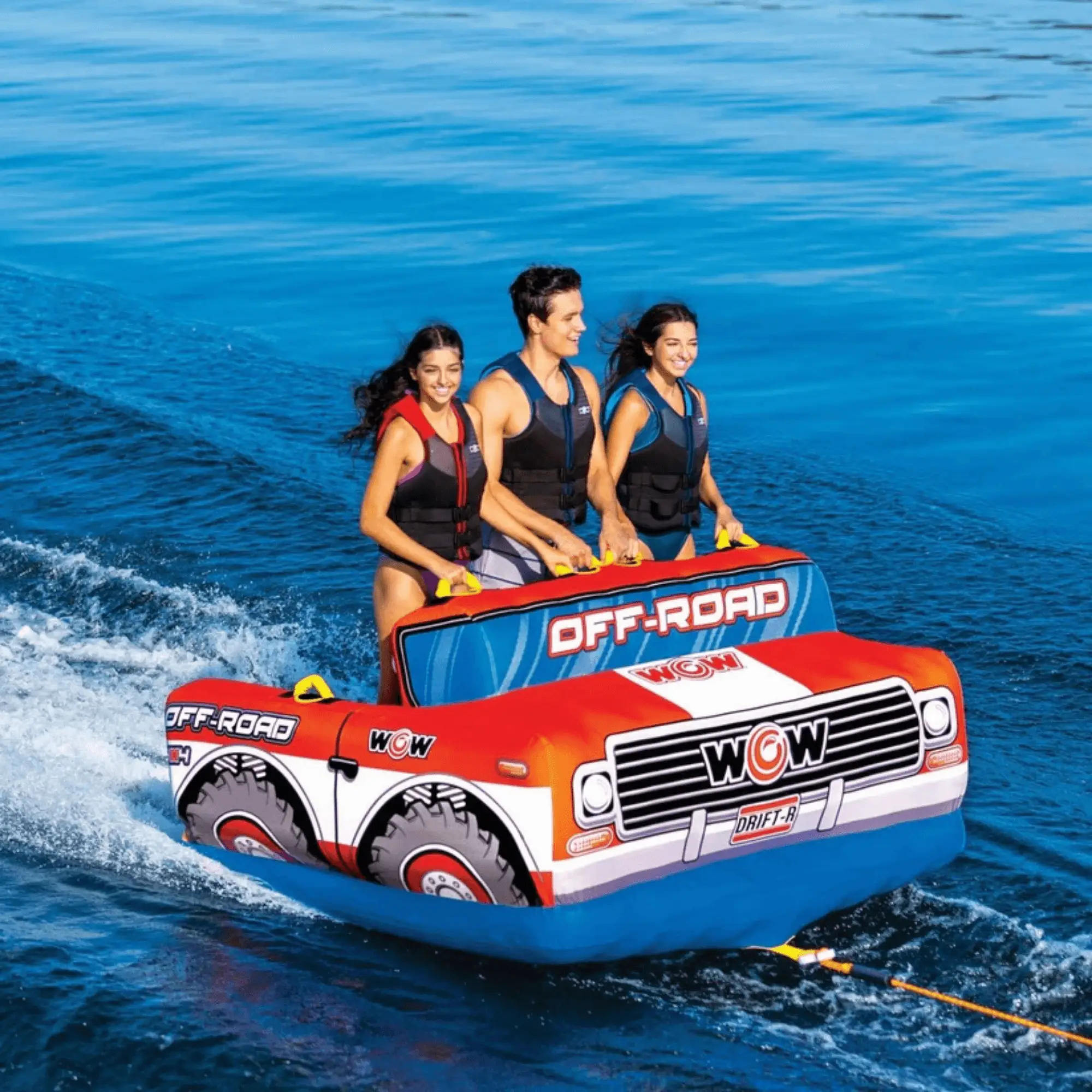 WOW Off-Road Truck 3-Person Towable in red-orange with three riders on blue water