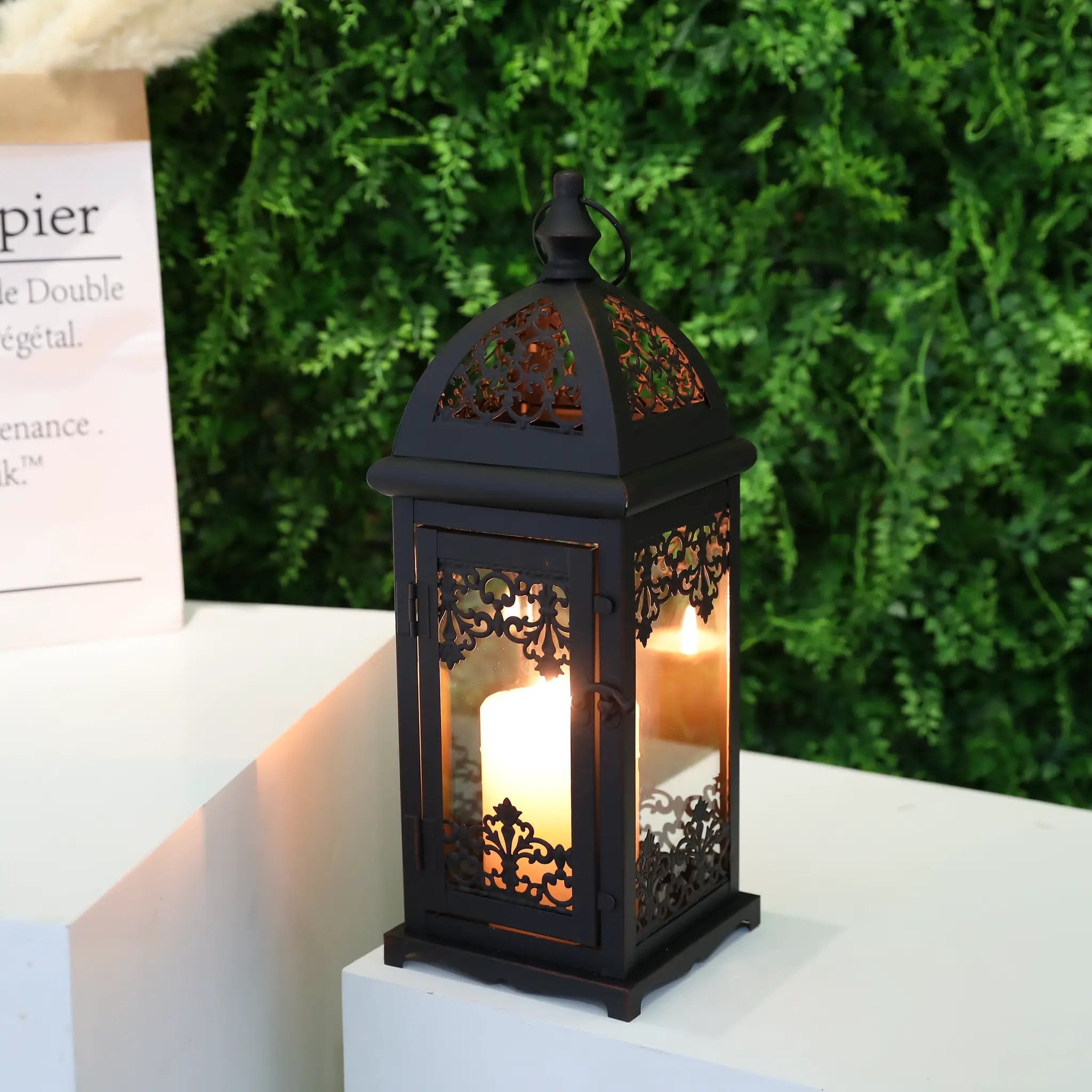 15-inch black decorative candle lantern with ornate metal lattice panels and warm candle glow