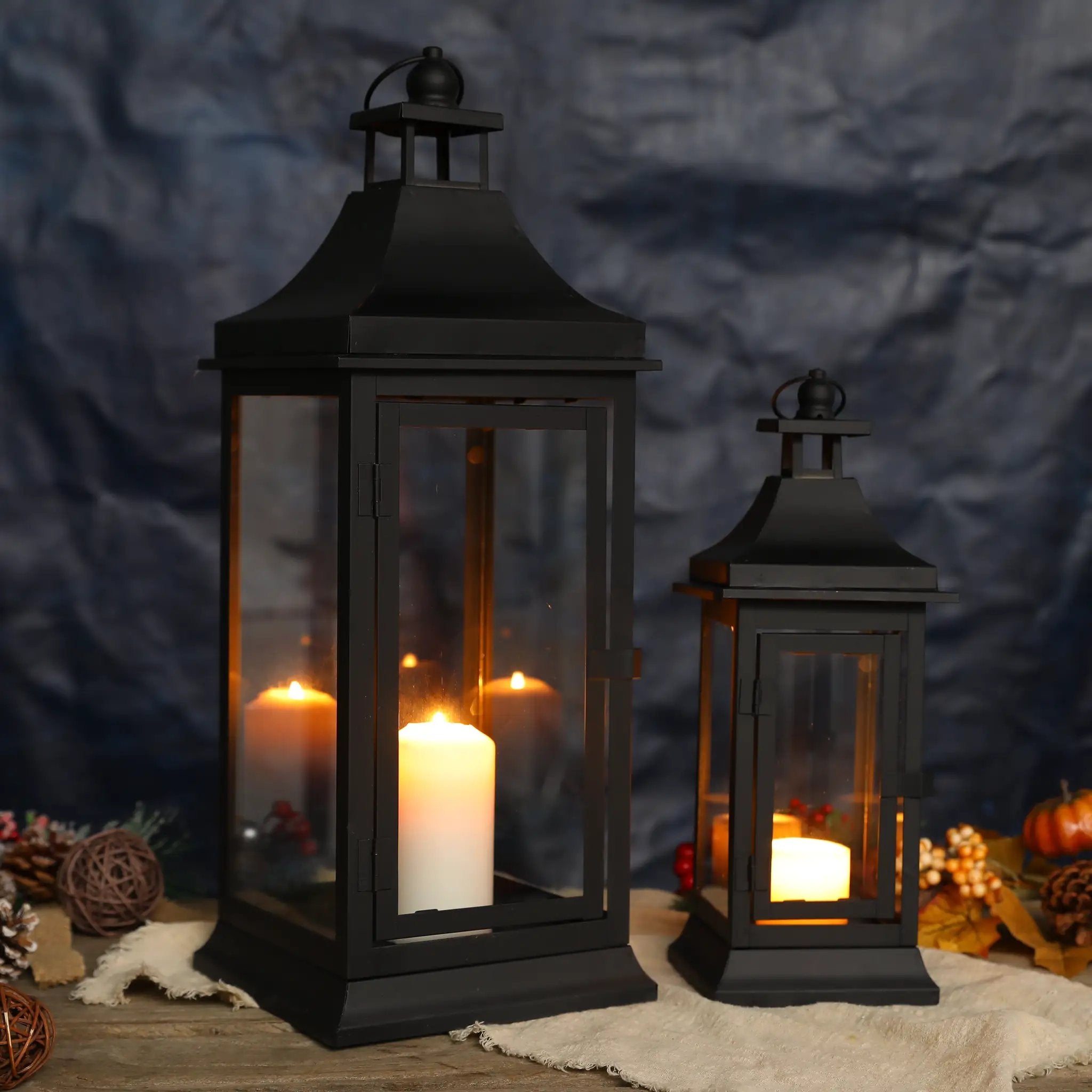 Decorative outdoor candle lanterns set of 2 by JHY DESIGN, black metal with glass panels and warm candles