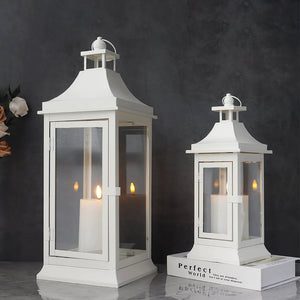 Outdoor decorative candle lanterns, white, set of 2 in 19.5in and 13in tall.