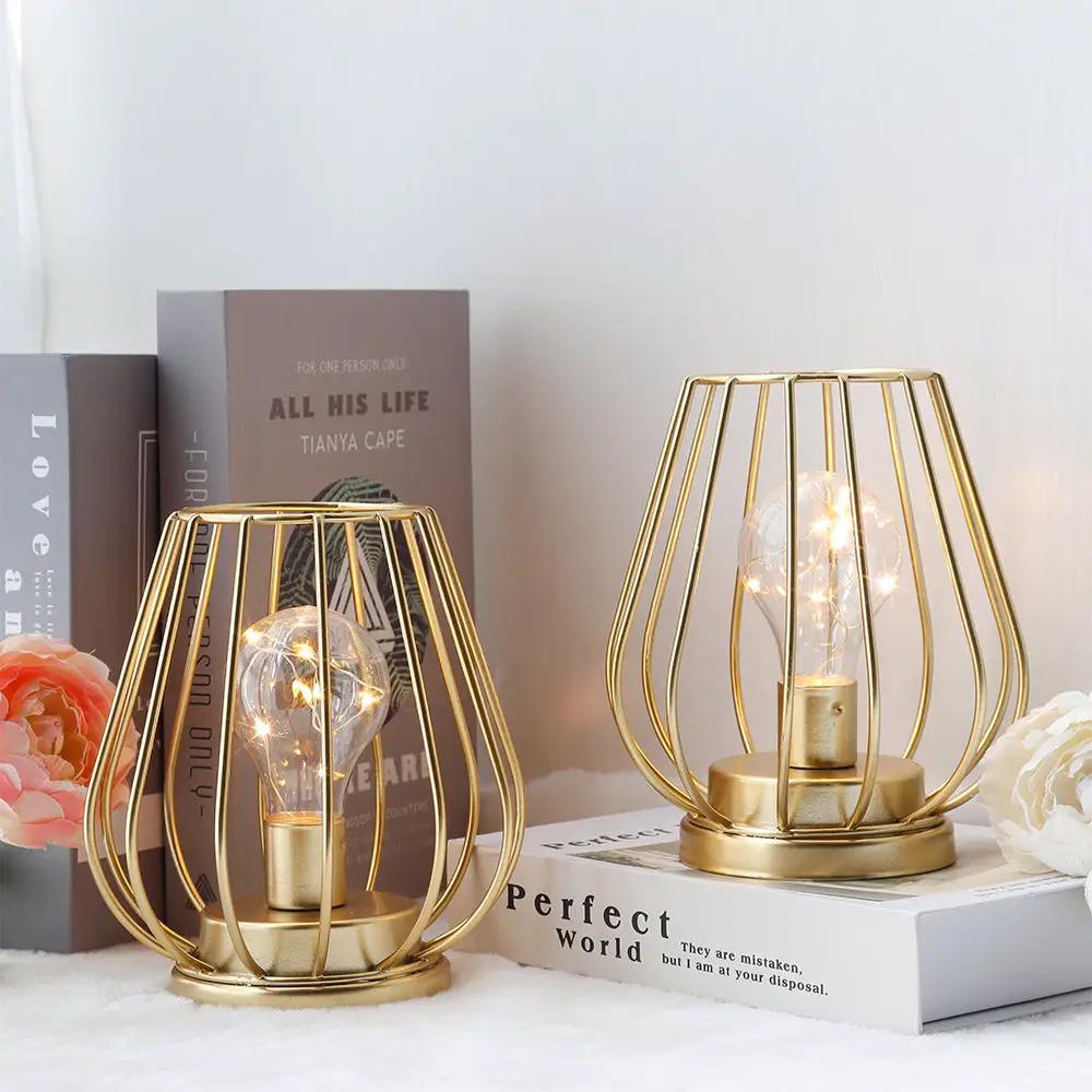 7-inch tall gold metal cage cordless table lanterns set of 2 with exposed bulbs