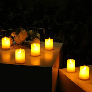 LED battery candles 2x2.8in, set of 6 by JHY DESIGN with warm amber LED glow on outdoor tables.