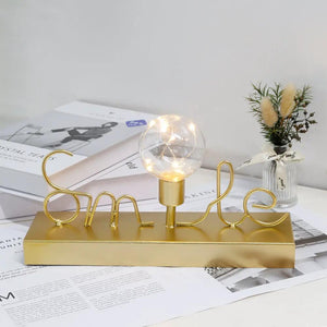 Decorative cordless lamp by JHY DESIGN with warm white fairy lights, gold base and Smile wire sculpture