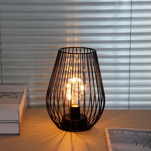 JHY DESIGN 8-inch tall cage-shaped battery-operated table lamp with a black metal wire frame