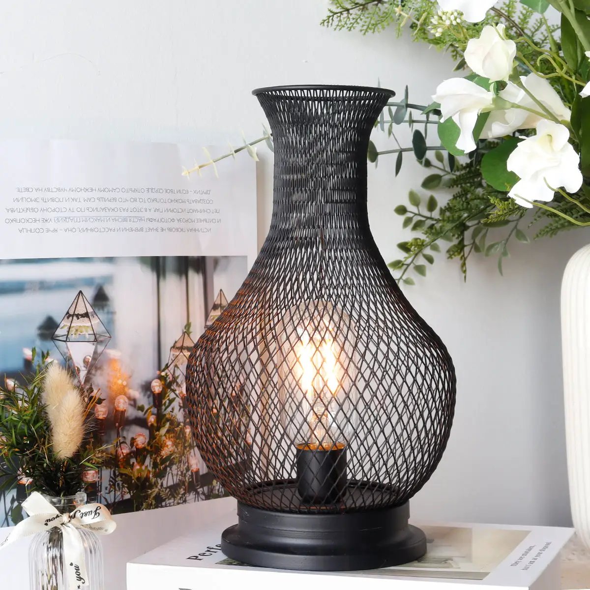 11-inch tall battery-operated lamp with black woven mesh cage and LED Edison bulb
