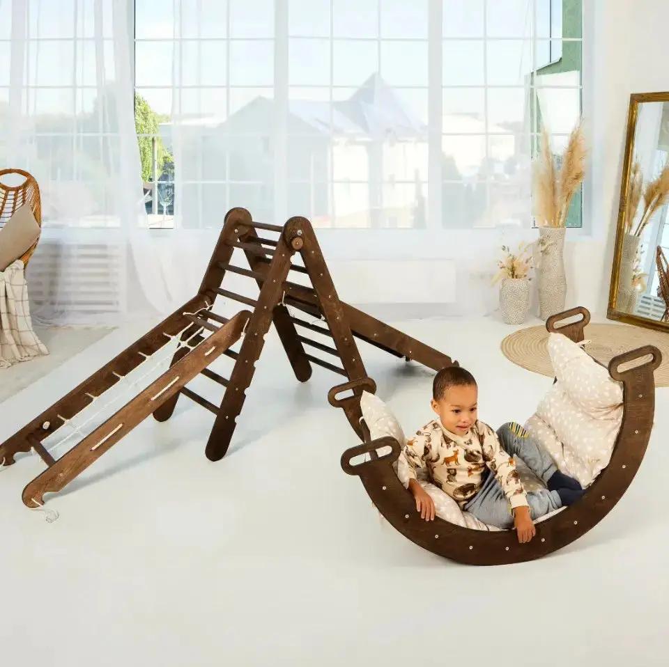 Goodevas 5in1 Montessori Climbing Set: brown wooden triangle ladder with arch rocker, slide board, rope net, and cushions