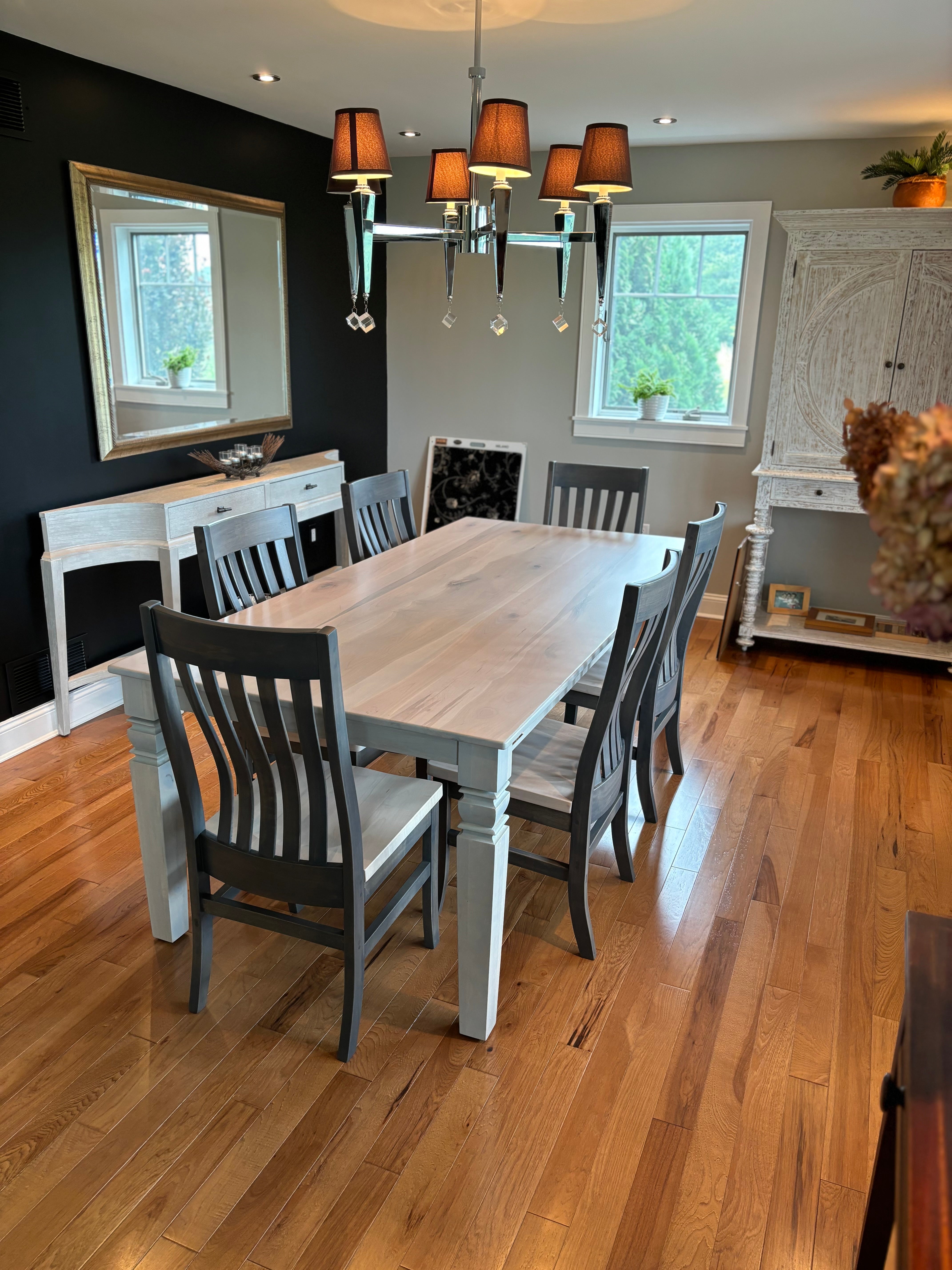 Levi 5 Slat dining chairs by Wooden Whale Workshop; six dark charcoal chairs around a light wood dining table